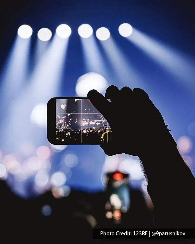 Concertgoer recording a live performance in Kuala Lumpur