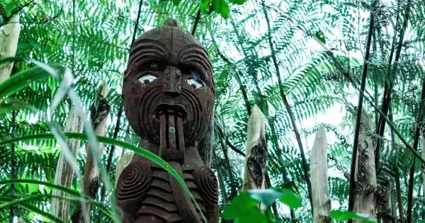 Māori statue standing proudly in a public space in Auckland parklands