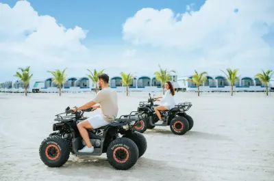 Couple riding ATVs on the beach - Lexis Hibiscus Port Dickson