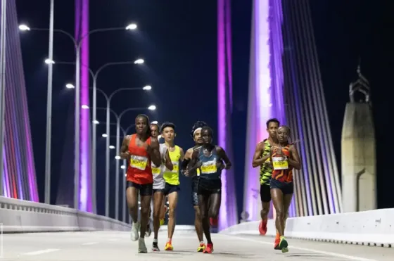 Runners participating in night marathon on the penang bridge