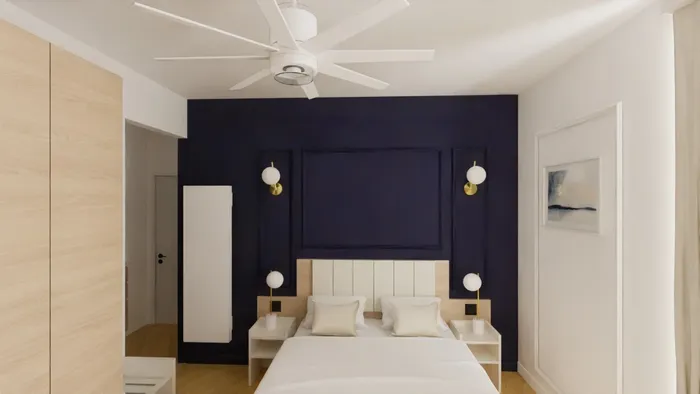 Chambre élégante avec lit, lampes, et mur bleu nuit à Les Sources Callou