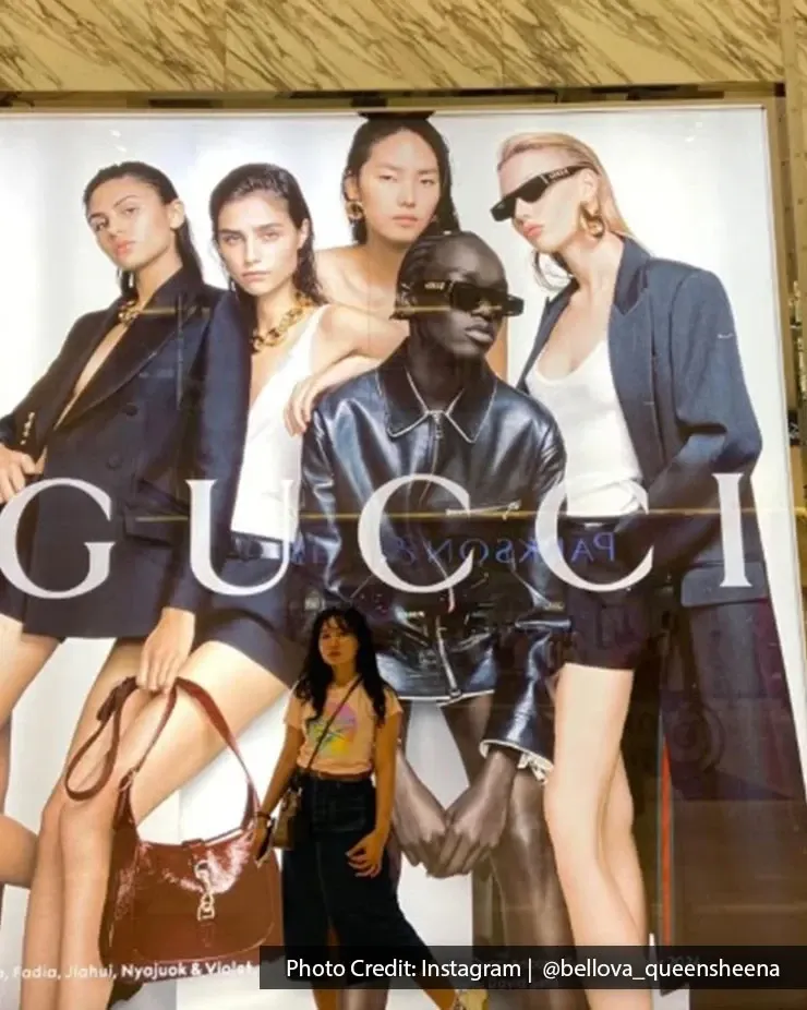 Visitor posing at Gucci boutique at Pavilion Kuala Lumpur luxury mall