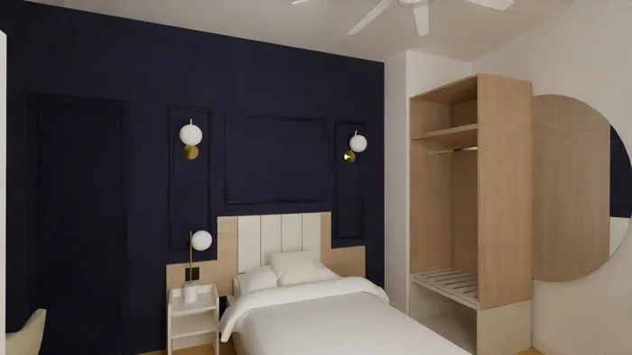 Chambre élégante avec lit, éclairage doré et placard intégré à Les Sources Callou.