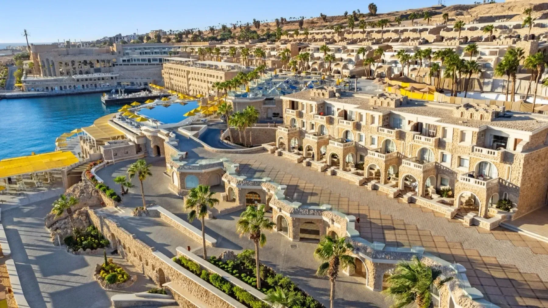 The Citadel's stone arches and terraces above its marina