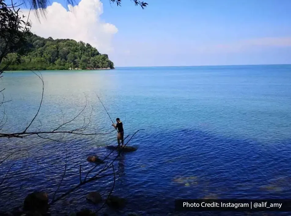 Man enjoy fishing at Blue Lagoon Beach Port Dickson