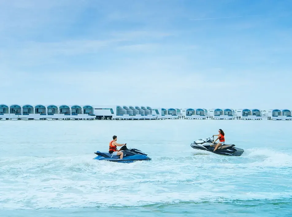 Couple enjoying a jet ski outdoor adventure.
