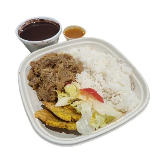 Haitian plate with rice and traditional sides at MYKalbas in Miami's MiMo neighborhood