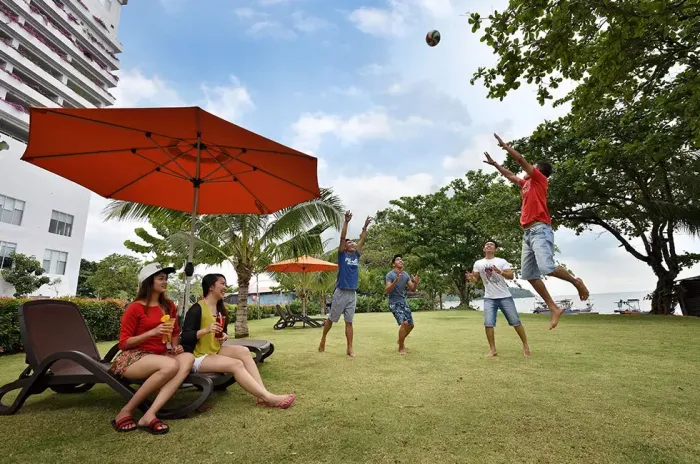 A group of people relaxing at Bayu Lexis - Lexis Suites Penang