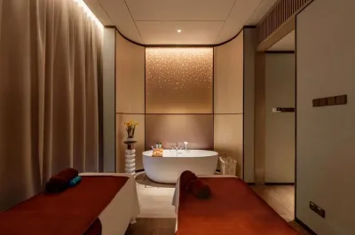 Relaxing couples treatment room at LexSpa, a premier luxury hotel spa in KL with a private soaking tub.