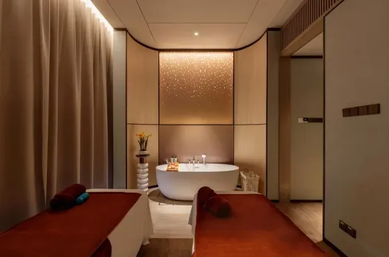Relaxing couples treatment room at LexSpa, a premier luxury hotel spa in KL with a private soaking tub.