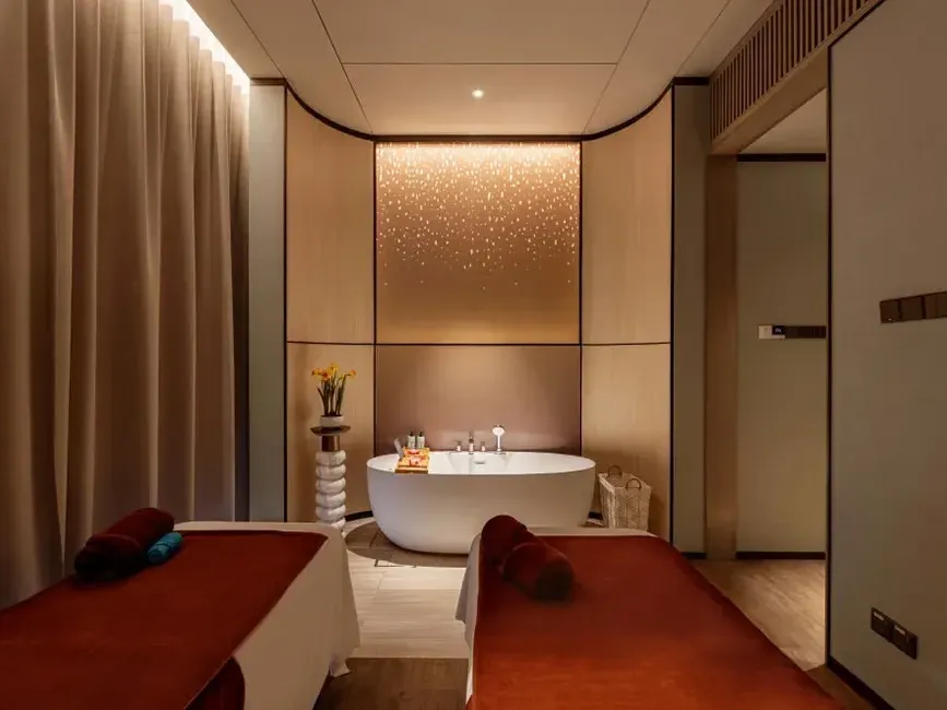 Relaxing couples treatment room at LexSpa, a premier luxury hotel spa in KL with a private soaking tub.