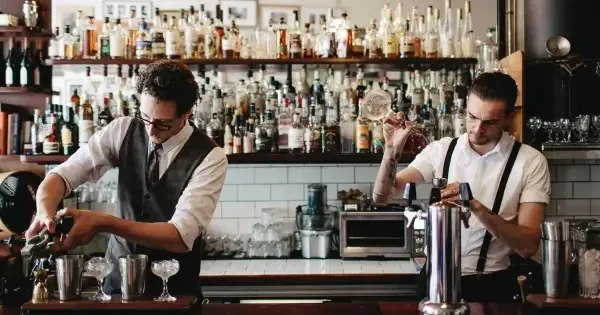 Two bartenders create cocktails at Crumpet, Wellington.