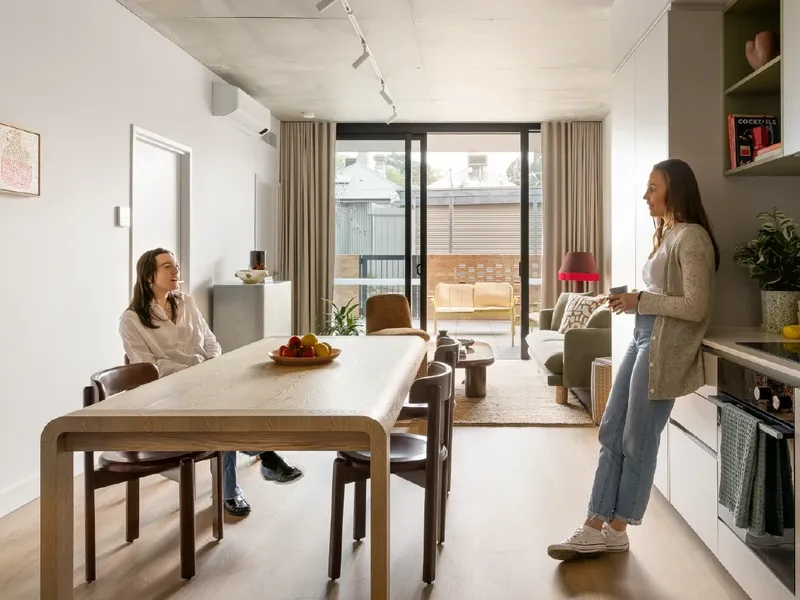 Two women in the 2 Bedroom Apartment kitchen at Swift Walk in Kensington.