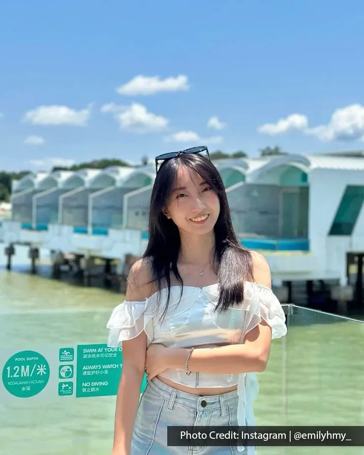 Visitor posing beside overwater villas at Lexis Hibiscus Port Dickson.