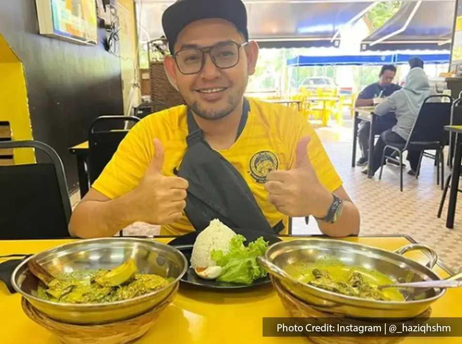 A man is satisfied with his local malaysian food