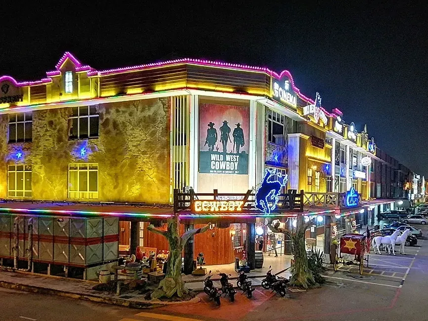 Exterior view of Wild West Cowboy Indoor Theme Park at night - Lexis Port Dickson