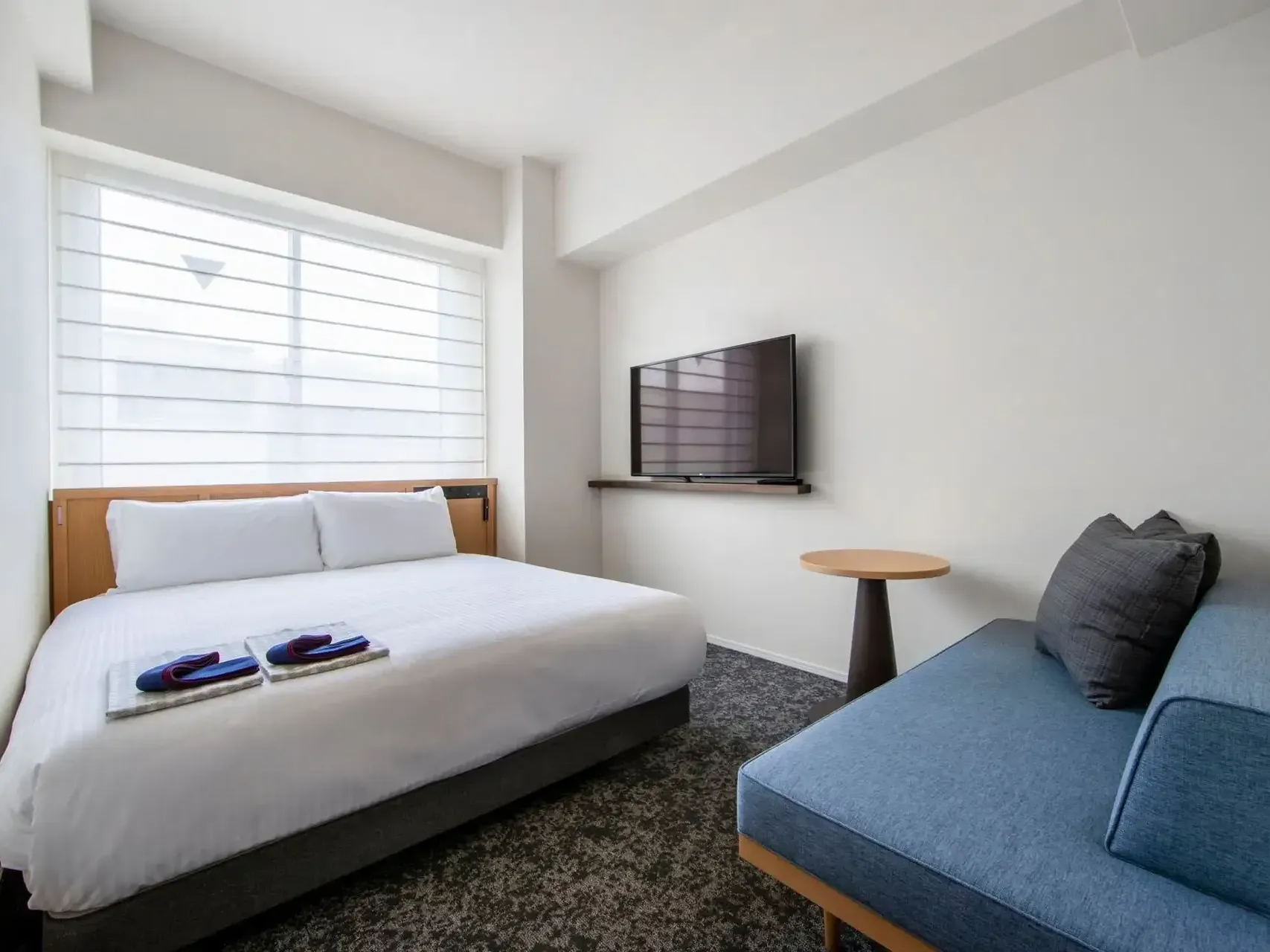 Comfy bed, TV and sitting area in Superior Double at Park Hotel Kyoto