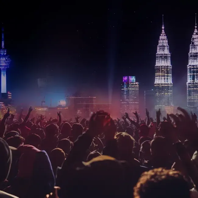  A diverse crowd enjoying a concert with a stunning city skyline visible behind them - Lexis Hotels & Resorts