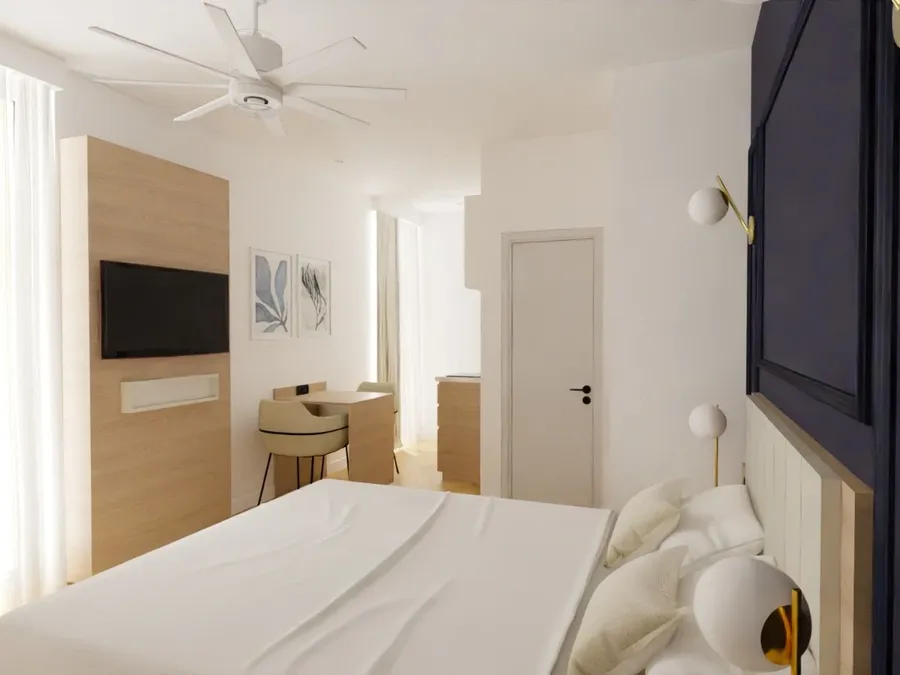 Chambre luxueuse avec balcon et mobilier moderne à l'hôtel Les Sources Callou à Vichy.