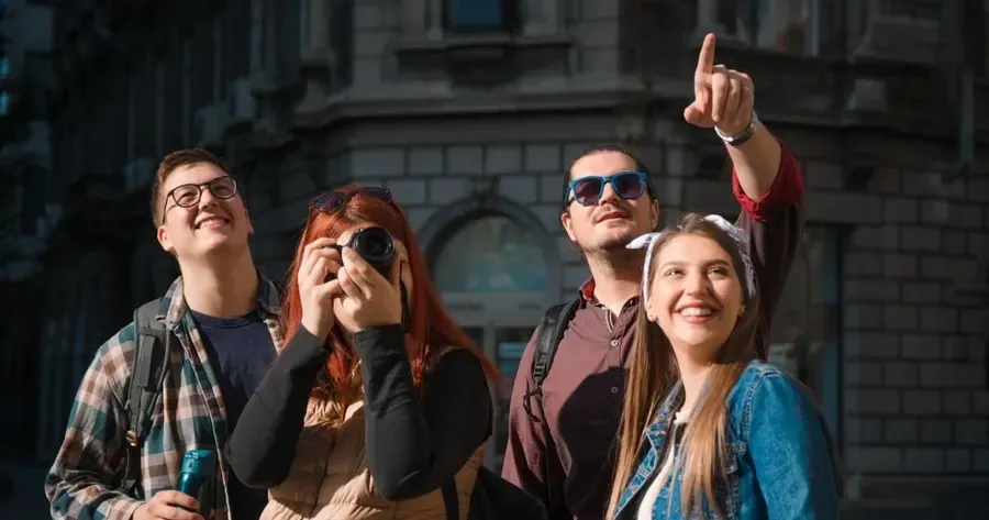 Group of tourists sightseeing and photographing notable Lord of the Rings filming locations in Wellington city.