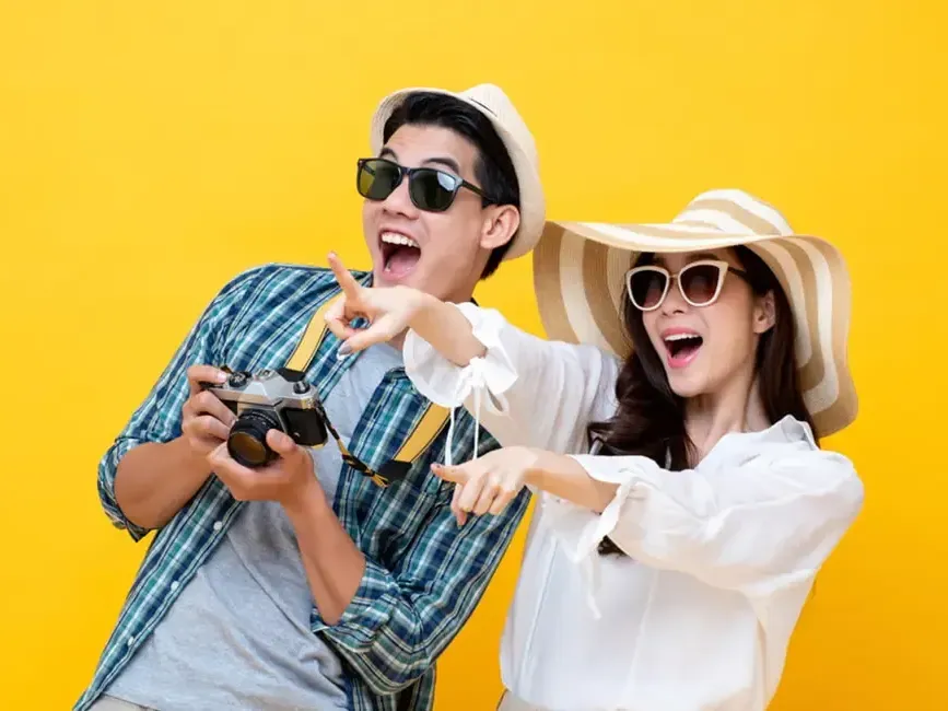 Couple wearing casual beach wear while holding a camera - Grand Lexis Port Dickson