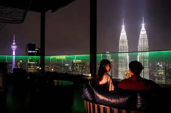 Couple enjoying night view at Satellite Restaurant & Bar (Al Fresco) – Imperial Lexis Kuala Lumpur