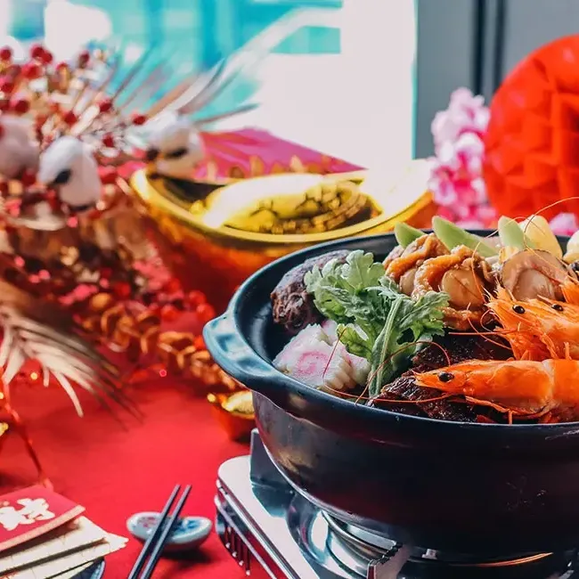 A pot of Poon Choi sits on a dining table at Umi Japanese Restaurant, Imperial Lexis KL - Lexis Hotels & Resorts
