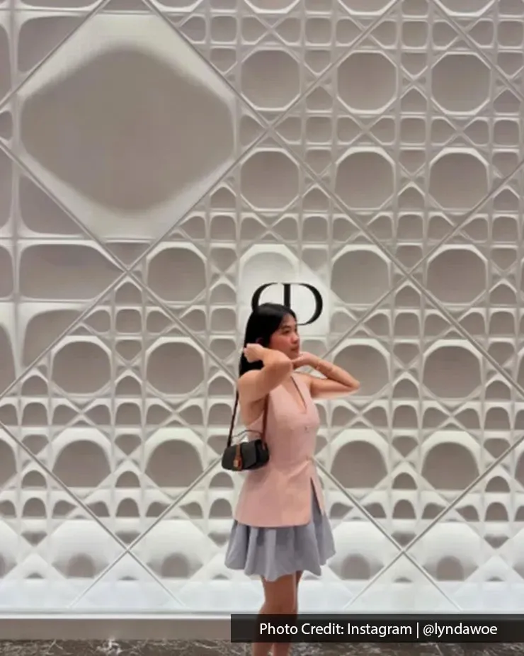 Visitor posing infront Christian Dior luxury retail wall at The Exchange TRX
