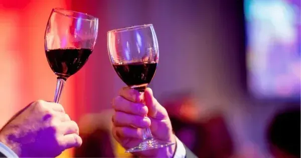 Glasses of wine being raised at an event at The Hotel Grand Chancellor in Adelaide