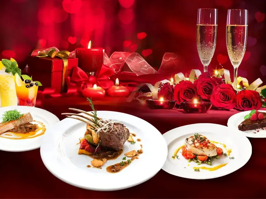 A table filled with delectable dishes accompanied with romantic decorations - Lexis Suites Penang