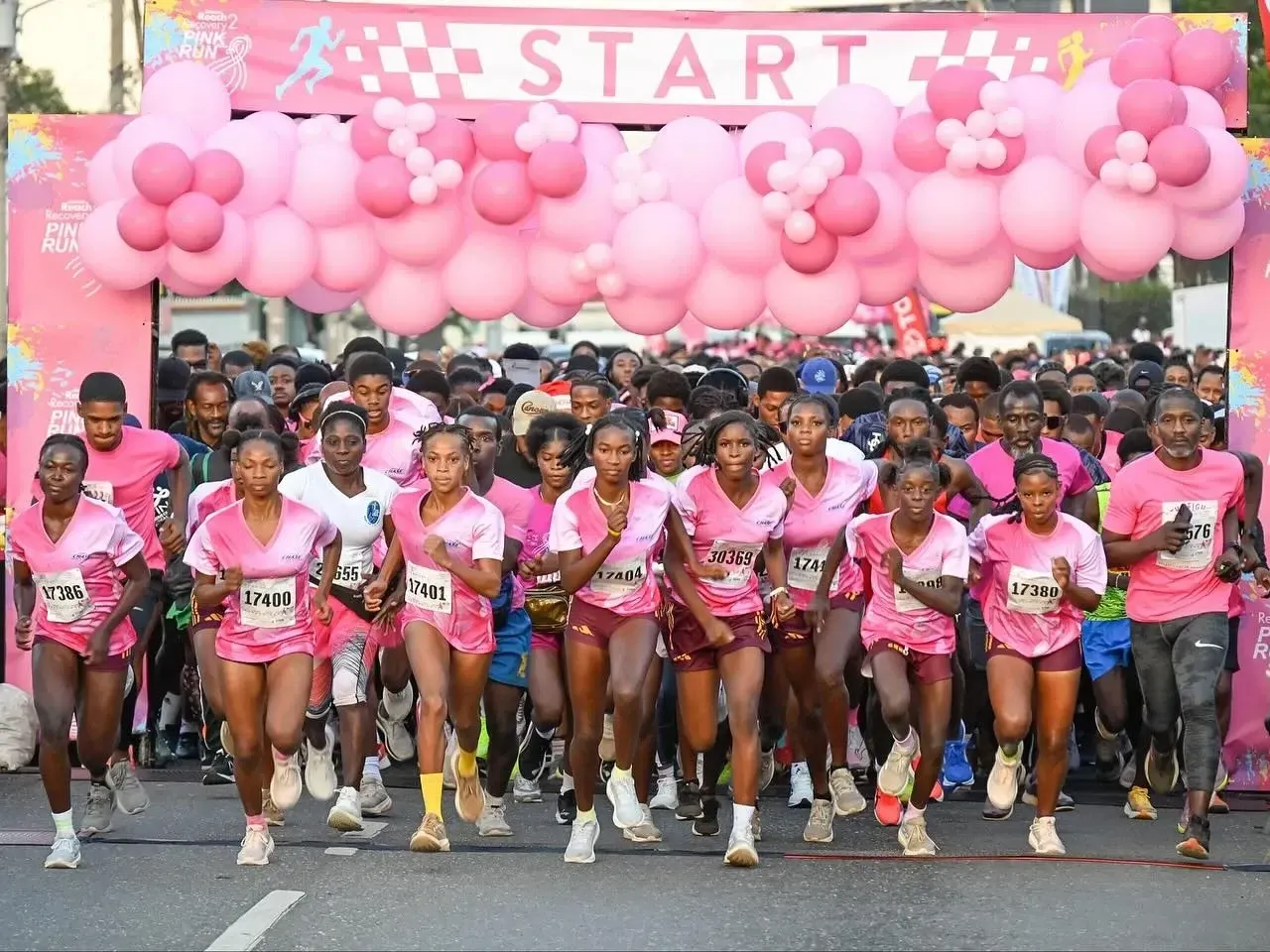 Runners at start line of Pink Run charity event highlighting things to do in Kingston Jamaica near Jamaica Pegasus Hotel