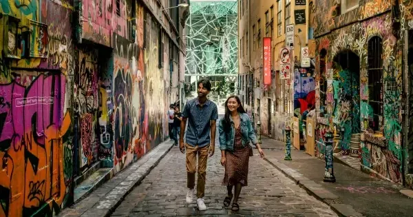 A couple exploring Hosier Lane in Melbourne.