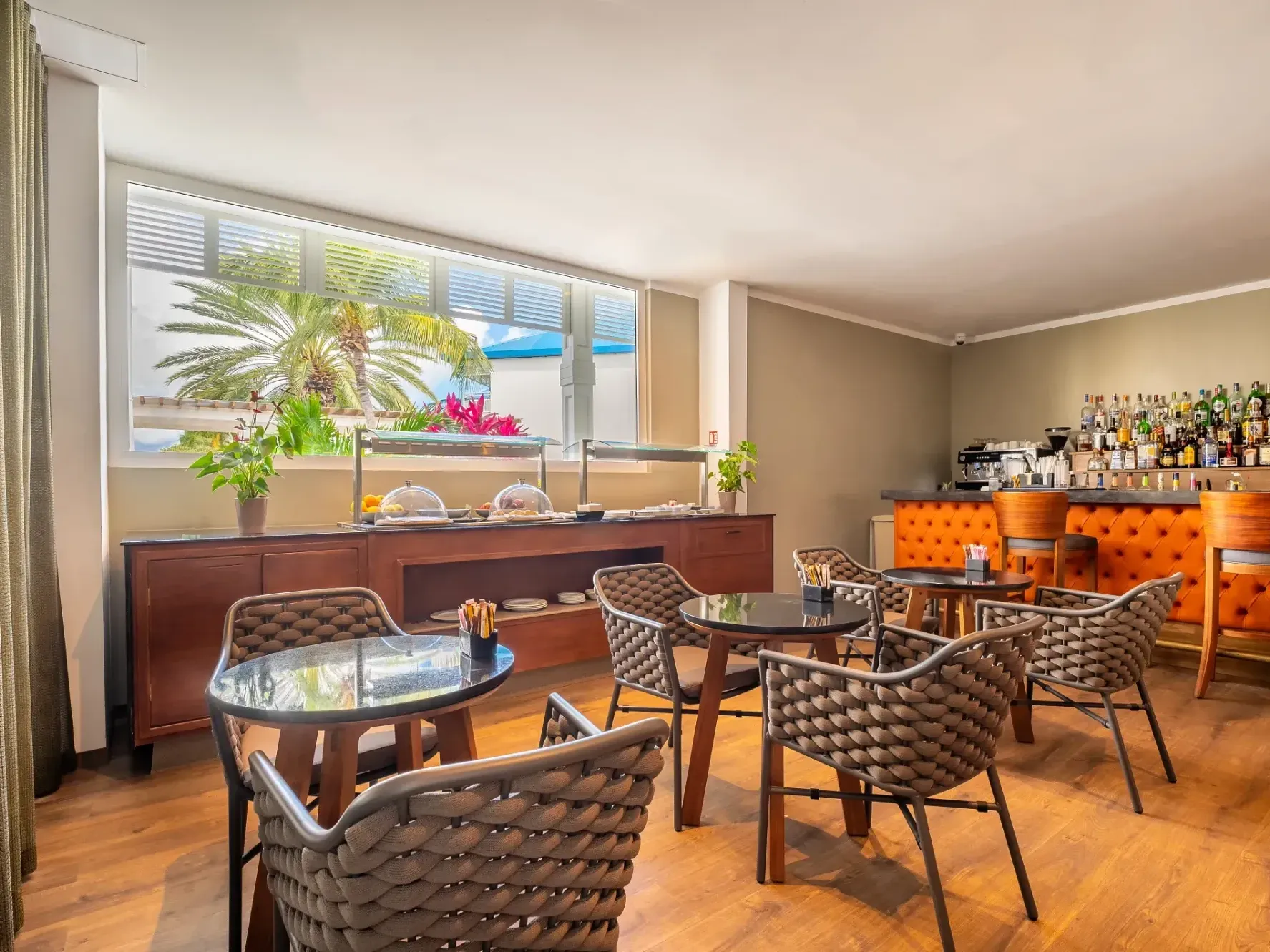 Rendezvous Lounge Bar with breakfast buffet & seating area at St. Martin Beach Resort, featuring St. Martin restaurants