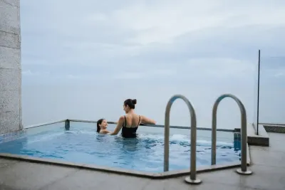 Mother and daughter enjoying the sea view in private pool - Lexis Hibiscus Port Dickson