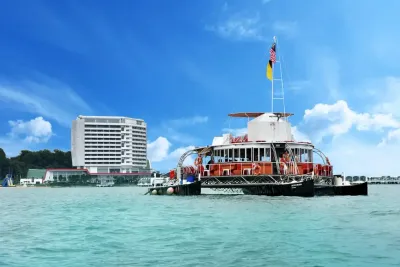Cruise boat on the water surrouned by a serene coastal landscape - Lexis Hibiscus Port Dickson