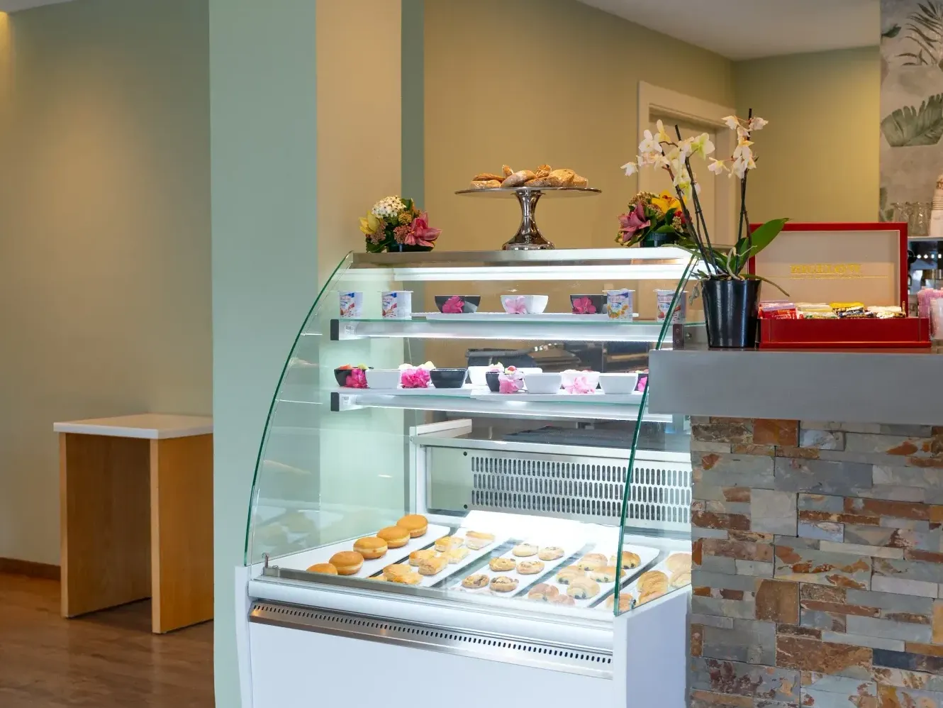 Baked pastries & snacks in a glass display case in Coco Café at St. Martin Beach Resort, a St. Martin all inclusive resort