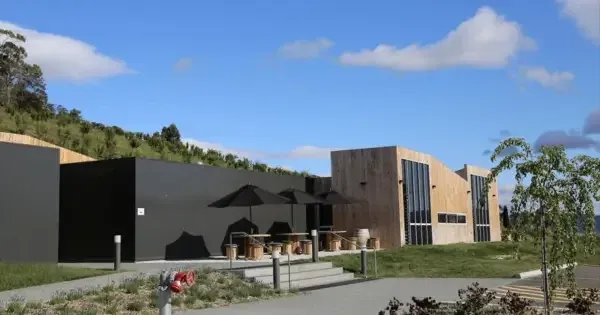 Building facade with umbrella and seats, and blue skies