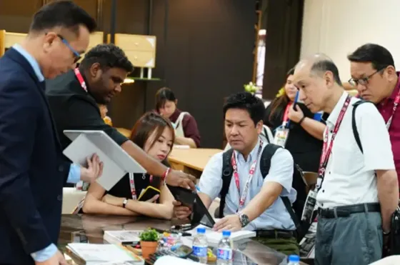 A group of people having a discussion at Malaysian International Furniture Fair - Imperial Lexis Kuala Lumpur