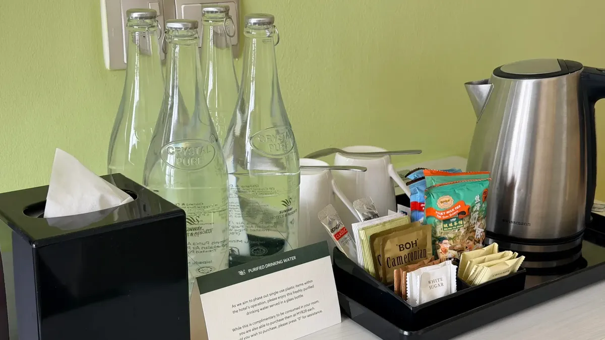 Bottled water, tea, and coffee setup on a tray at Sunway Velocity Hotel in Kuala Lumpur.