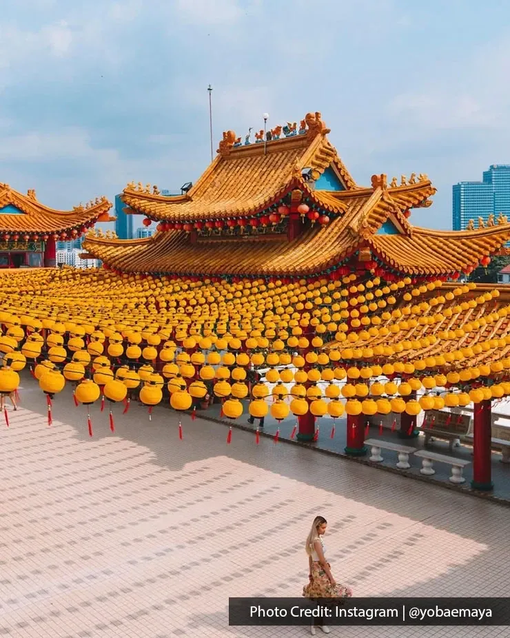 Thean Hou Temple decorated with rows of yellow lanterns.