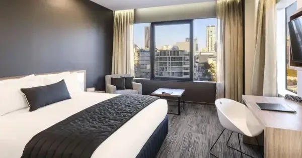Modern room at Hotel Grand Chancellor Brisbane with city views and workspace