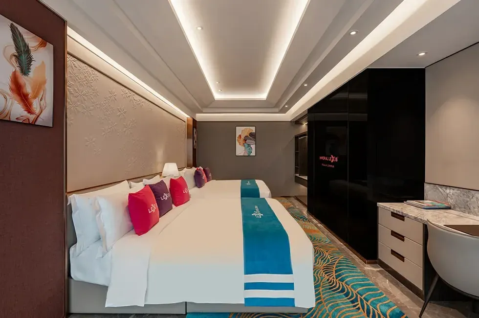 Two king beds in the Royal Suite with a working table - Imperial Lexis Kuala Lumpur