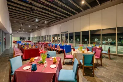 Dining area with tablecloths and flowers at Horizon Deck  - Lexis Hibiscus Port Dickson