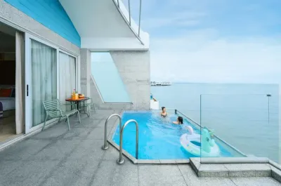 Family enjoying private pool with sea view - Lexis Hibiscus Port Dickson