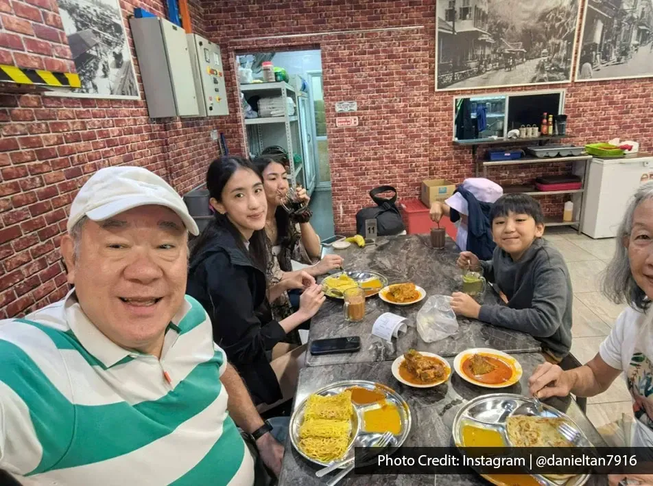 Group dining at Line Clear Nasi Kandar Penang Airport with curry and roti on table