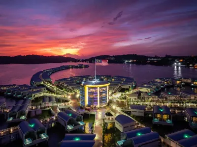 Aerial view of Lexis Hibiscus Port Dickson with Malaysian flag at sunset