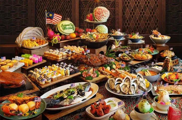 A buffet table showcasing a colourful array of traditional Malaysian dishes - Imperial Lexis Kuala Lumpur