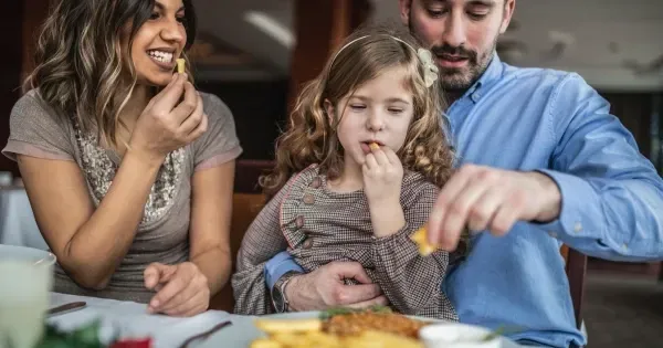 Family shares a plate of fish and chips