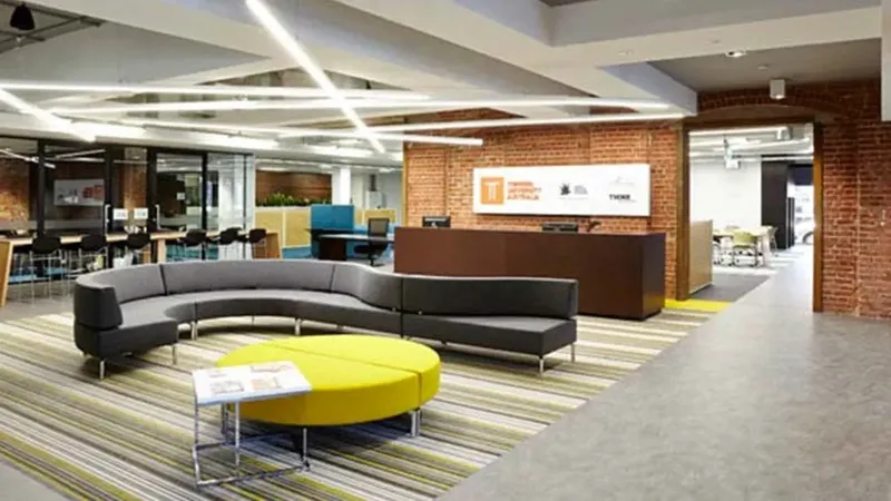 Collaborative study space with seating and a brick wall at Torrens University, near Ibis Adelaid