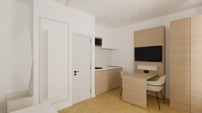 Chambre moderne avec bureau et télévision intégrée chez Les Sources Callou.
